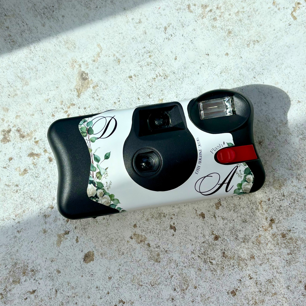 Front of personalised eucalyptus and rose wedding Kodak FunSaver disposable camera