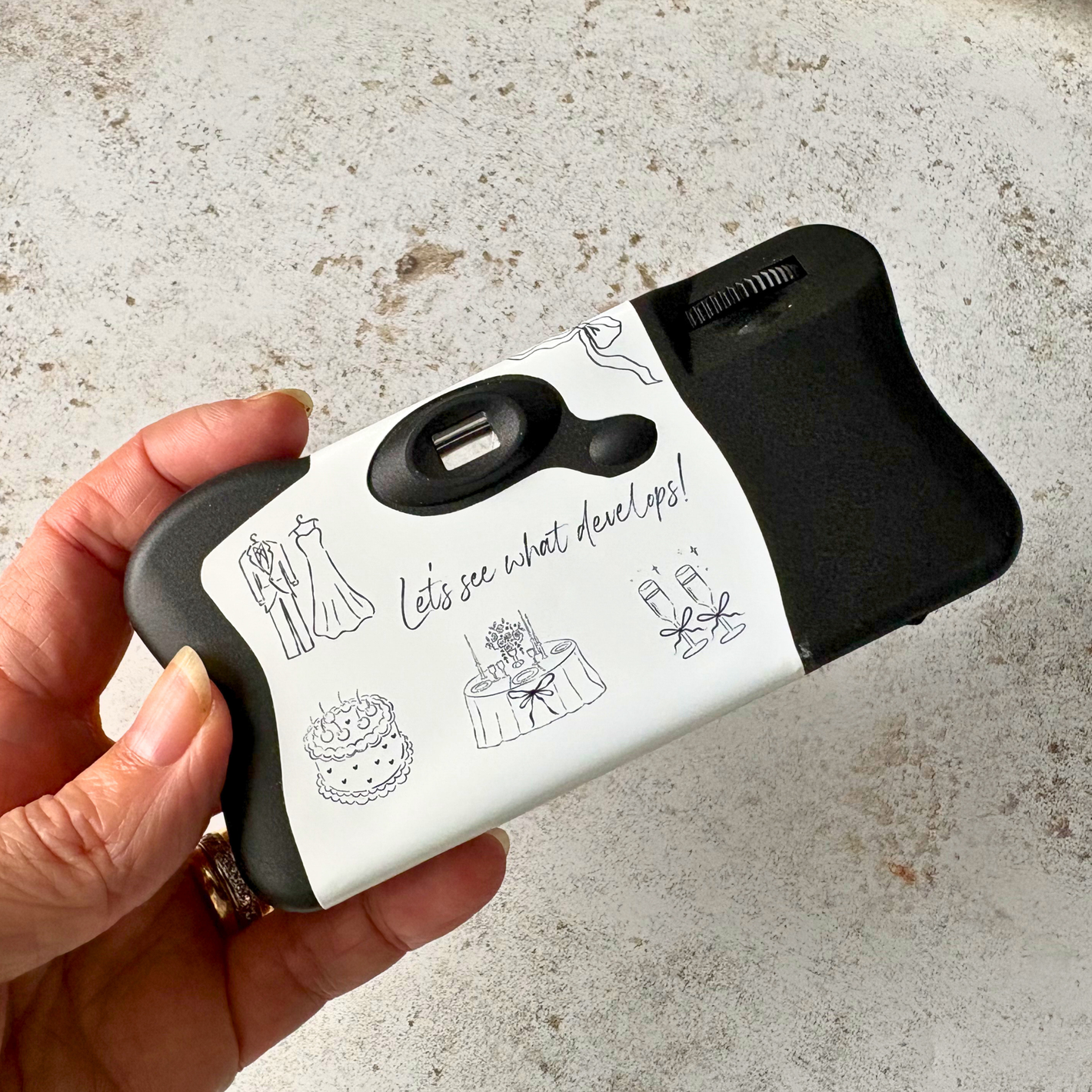 Rear view of a minimalist wedding camera wrap fitted to a Kodak FunSaver