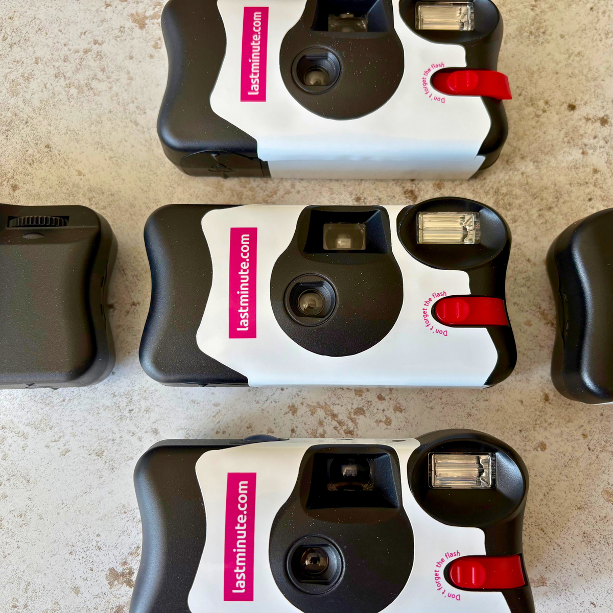 lastminute.com white and pink branded disposable cameras front