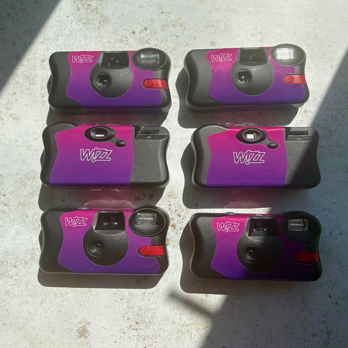 Wizz Air purple branded disposable cameras previous airline client commission