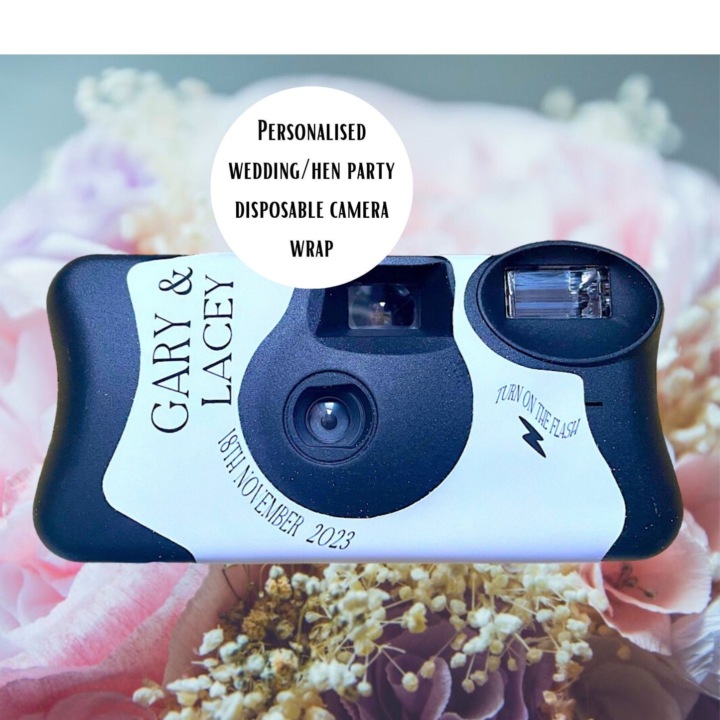 KodakFunSaver disposable camera replacement personalised sticker for your wedding.  Shown on a beach with a rock and a little plant in the foreground and the sea in the background.